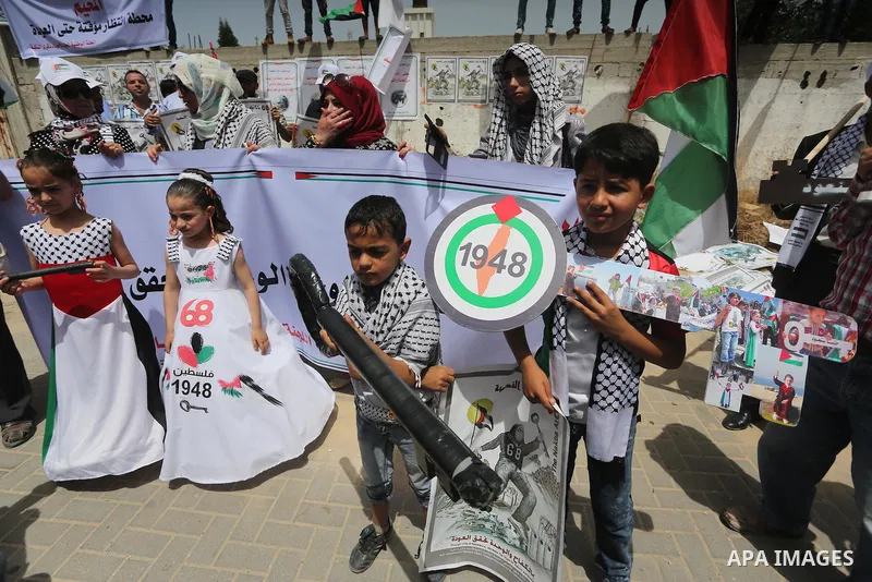Palestinians wave national flags on May 15, 2016 in Gaza city during a rally to commemorate the "Nakba" or "catastrophe" in Arabic in reference to the establishment in 1948 of the state of Israel. "Nakba" means in Arabic...