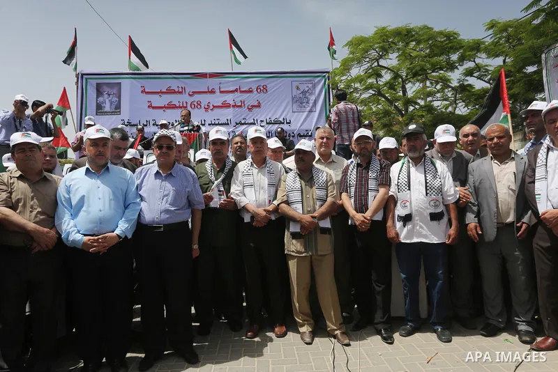 Palestinians wave national flags on May 15, 2016 in Gaza city during a rally to commemorate the "Nakba" or "catastrophe" in Arabic in reference to the establishment in 1948 of the state of Israel. "Nakba" means in Arabic...