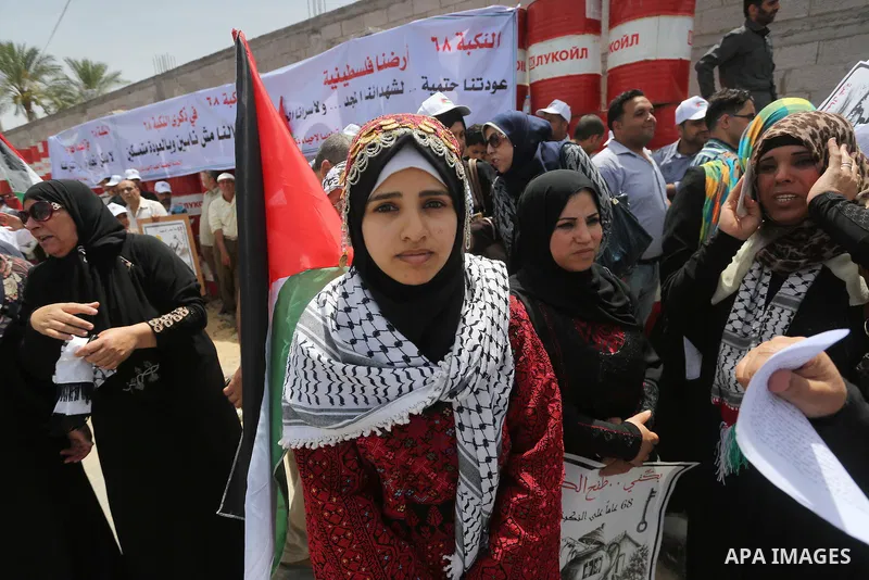 Palestinians wave national flags on May 15, 2016 in Gaza city during a rally to commemorate the "Nakba" or "catastrophe" in Arabic in reference to the establishment in 1948 of the state of Israel. "Nakba" means in Arabic...