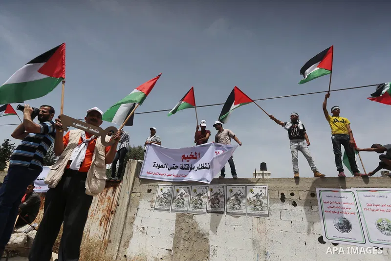 Palestinians wave national flags on May 15, 2016 in Gaza city during a rally to commemorate the "Nakba" or "catastrophe" in Arabic in reference to the establishment in 1948 of the state of Israel. "Nakba" means in Arabic...