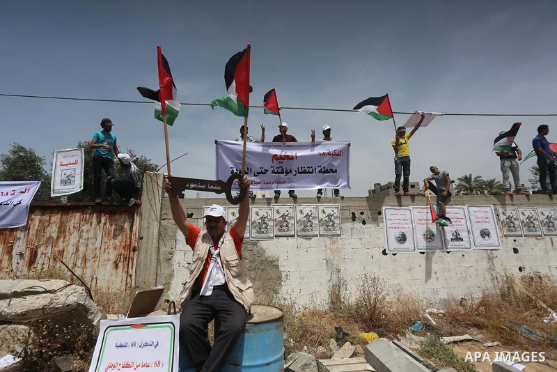 Palestinians wave national flags on May 15, 2016 in Gaza city during a rally to commemorate the "Nakba" or "catastrophe" in Arabic in reference to the establishment in 1948 of the state of Israel. "Nakba" means in Arabic...