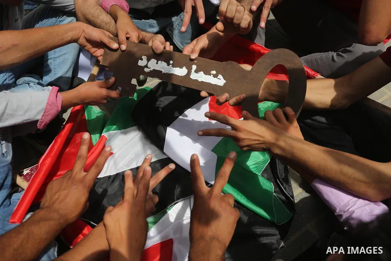 Palestinians wave national flags on May 15, 2016 in Gaza city during a rally to commemorate the "Nakba" or "catastrophe" in Arabic in reference to the establishment in 1948 of the state of Israel. "Nakba" means in Arabic...