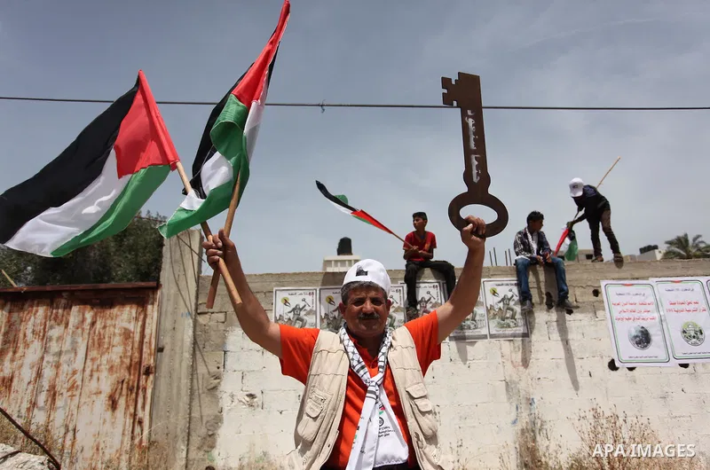 Palestinians wave national flags on May 15, 2016 in Gaza city during a rally to commemorate the "Nakba" or "catastrophe" in Arabic in reference to the establishment in 1948 of the state of Israel. "Nakba" means in Arabic...