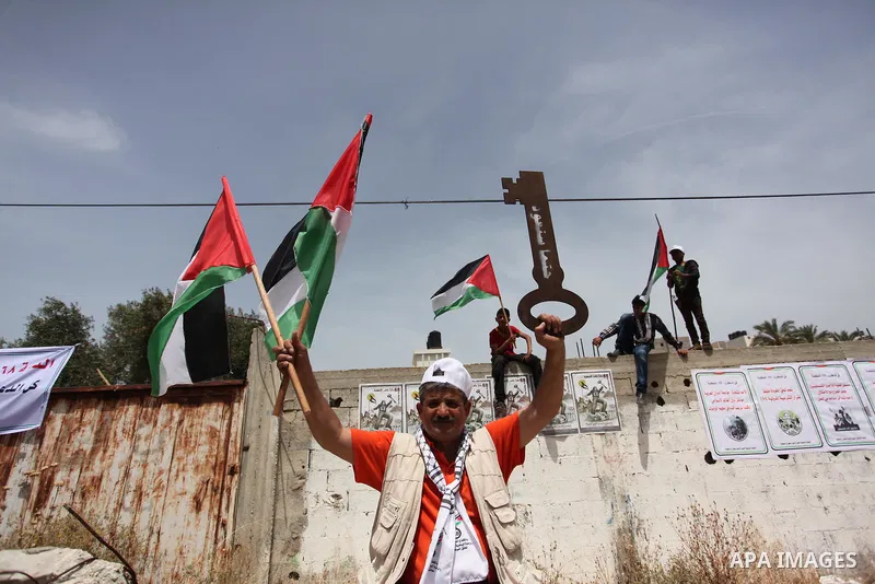 Palestinians wave national flags on May 15, 2016 in Gaza city during a rally to commemorate the "Nakba" or "catastrophe" in Arabic in reference to the establishment in 1948 of the state of Israel. "Nakba" means in Arabic...