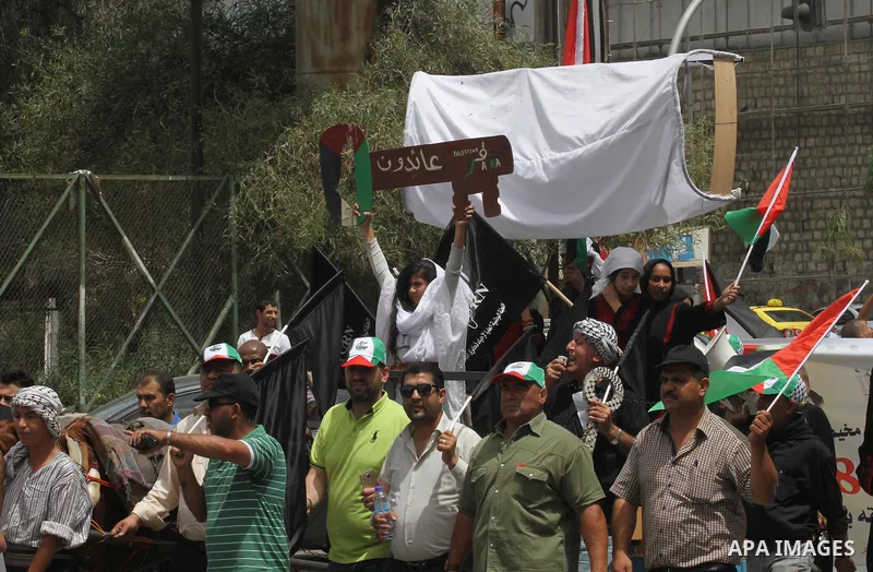 Palestinians wave national flags on May 15, 2016 in the West Bank city of Nablus during a rally to commemorate the "Nakba" or "catastrophe" in Arabic in reference to the establishment in 1948 of the state of Israel. "Nak...