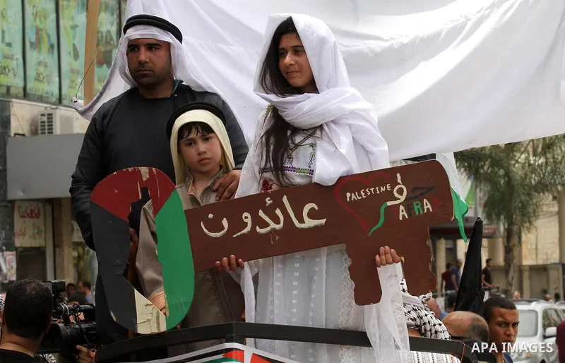 Palestinians wave national flags on May 15, 2016 in the West Bank city of Nablus during a rally to commemorate the "Nakba" or "catastrophe" in Arabic in reference to the establishment in 1948 of the state of Israel. "Nak...