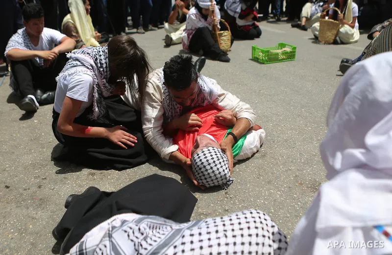 Palestinians re-enact a scene from the 1948 Nakba during a rally marking the 68th anniversary of the Nakba in the West Bank city of Ramallah May 15, 2016. "Nakba" means in Arabic "catastrophe" in reference to the birth o...