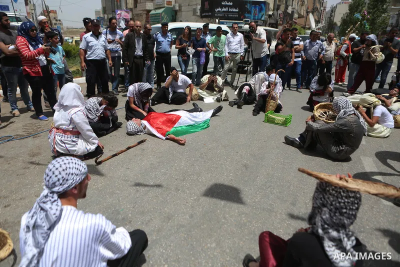 Palestinians re-enact a scene from the 1948 Nakba during a rally marking the 68th anniversary of the Nakba in the West Bank city of Ramallah May 15, 2016. "Nakba" means in Arabic "catastrophe" in reference to the birth o...