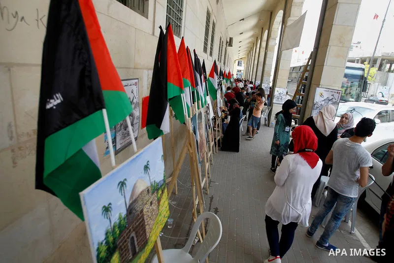 Palestinian artists paint artwork during a rally marking the 68th anniversary of the Nakba in the West Bank city of Hebron May 15, 2016. "Nakba" means in Arabic "catastrophe" in reference to the birth of the state of Isr...