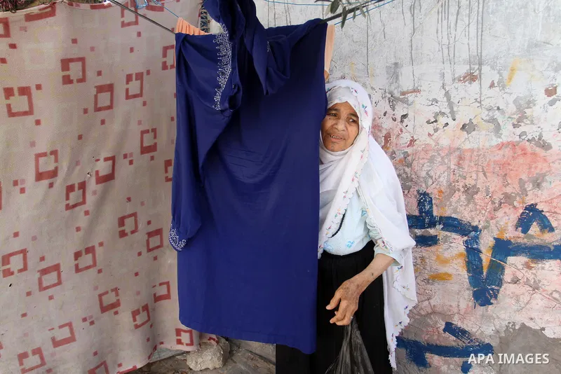A Palestinian woman stands outside her house on the 68th anniversary of the "Nakba" in the southern Gaza Strip town of Khan Younis on May 15, 2016. "Nakba" means in Arabic "catastrophe" in reference to the birth of the s...
