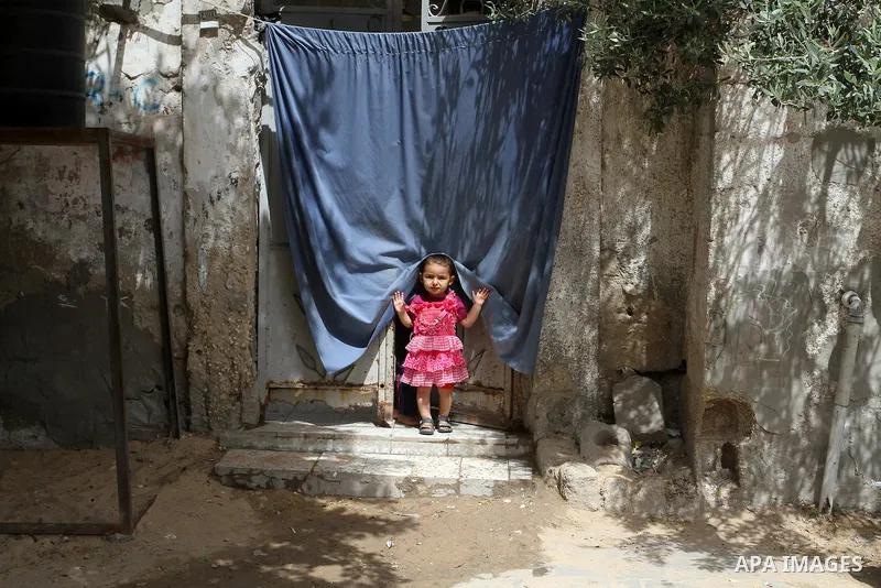 A Palestinian girl stands outside his family house on the 68th anniversary of the "Nakba" in the southern Gaza Strip town of Khan Younis on May 15, 2016. "Nakba" means in Arabic "catastrophe" in reference to the birth of...