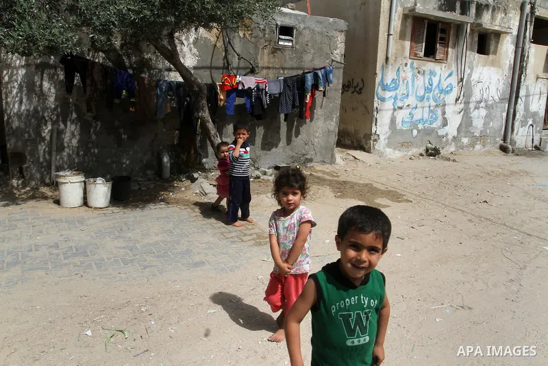 Palestinian children stand outside their family house on the 68th anniversary of the "Nakba" in the southern Gaza Strip town of Khan Younis on May 15, 2016. "Nakba" means in Arabic "catastrophe" in reference to the birth...