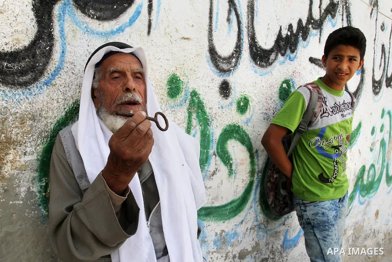 A palestinian man holds key symbolising the homes they left in 1948 in front of his house in the southern Gaza Strip town of Khan Younis on May 15, 2016. "Nakba" means in Arabic "catastrophe" in reference to the birth of...