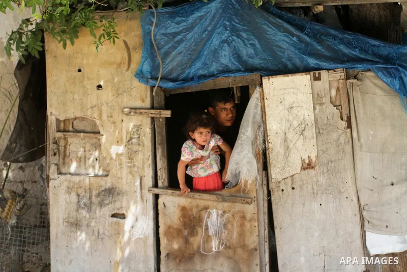 Palestinian children stand outside their family house on the 68th anniversary of the "Nakba" in the southern Gaza Strip town of Khan Younis on May 15, 2016. "Nakba" means in Arabic "catastrophe" in reference to the birth...