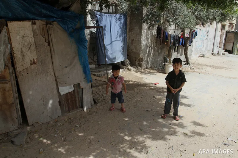 Palestinian children stand outside their family house on the 68th anniversary of the "Nakba" in the southern Gaza Strip town of Khan Younis on May 15, 2016. "Nakba" means in Arabic "catastrophe" in reference to the birth...