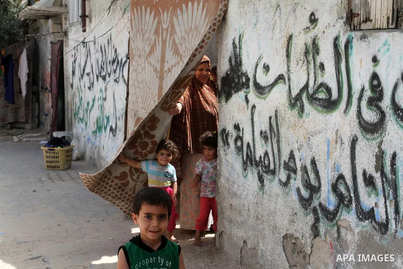 Palestinian children stand outside their family house on the 68th anniversary of the "Nakba" in the southern Gaza Strip town of Khan Younis on May 15, 2016. "Nakba" means in Arabic "catastrophe" in reference to the birth...