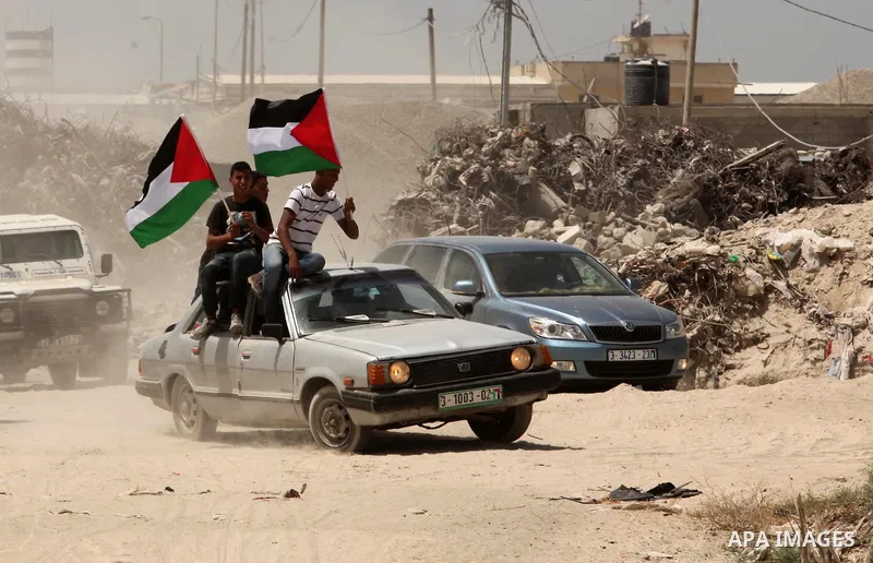 Palestinians take part during a rally to commemorate the "Nakba" or "catastrophe" in Arabic in reference to the establishment in 1948 of the state of Israel near the Nahal Oz crossing east of Gaza City on May 15, 2016. "...