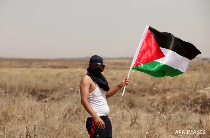 Palestinians take part during a rally to commemorate the "Nakba" or "catastrophe" in Arabic in reference to the establishment in 1948 of the state of Israel near the Nahal Oz crossing east of Gaza City on May 15, 2016. "...