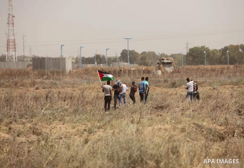 Palestinians take part during a rally to commemorate the "Nakba" or "catastrophe" in Arabic in reference to the establishment in 1948 of the state of Israel near the Nahal Oz crossing east of Gaza City on May 15, 2016. "...
