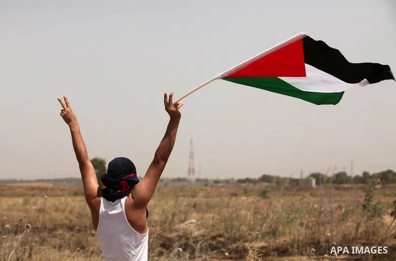 Palestinians take part during a rally to commemorate the "Nakba" or "catastrophe" in Arabic in reference to the establishment in 1948 of the state of Israel near the Nahal Oz crossing east of Gaza City on May 15, 2016. "...