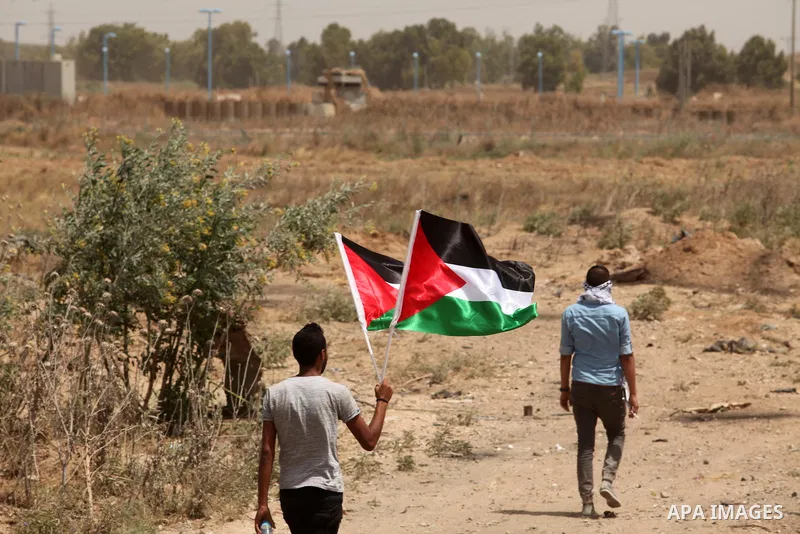 Palestinians take part during a rally to commemorate the "Nakba" or "catastrophe" in Arabic in reference to the establishment in 1948 of the state of Israel near the Nahal Oz crossing east of Gaza City on May 15, 2016. "...