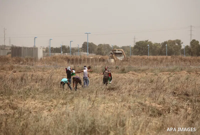 Palestinians take part during a rally to commemorate the "Nakba" or "catastrophe" in Arabic in reference to the establishment in 1948 of the state of Israel near the Nahal Oz crossing east of Gaza City on May 15, 2016. "...