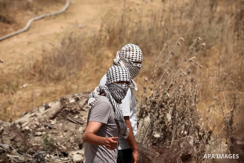 Palestinians take part during a rally to commemorate the "Nakba" or "catastrophe" in Arabic in reference to the establishment in 1948 of the state of Israel near the Nahal Oz crossing east of Gaza City on May 15, 2016. "...