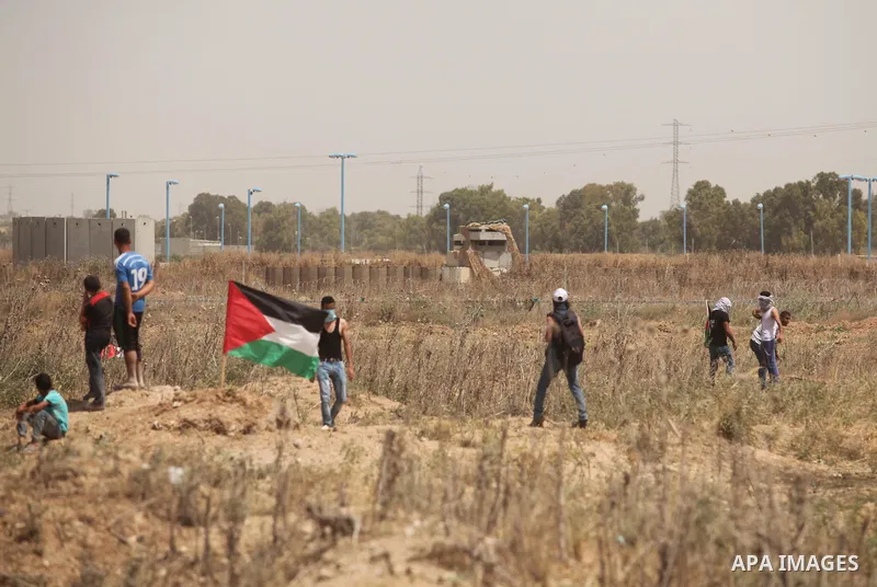 Palestinians take part during a rally to commemorate the "Nakba" or "catastrophe" in Arabic in reference to the establishment in 1948 of the state of Israel near the Nahal Oz crossing east of Gaza City on May 15, 2016. "...
