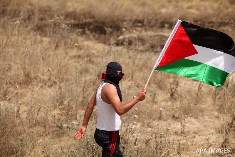 Palestinians take part during a rally to commemorate the "Nakba" or "catastrophe" in Arabic in reference to the establishment in 1948 of the state of Israel near the Nahal Oz crossing east of Gaza City on May 15, 2016. "...