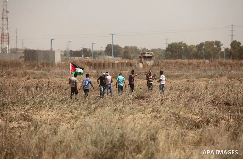 Palestinians take part during a rally to commemorate the "Nakba" or "catastrophe" in Arabic in reference to the establishment in 1948 of the state of Israel near the Nahal Oz crossing east of Gaza City on May 15, 2016. "...