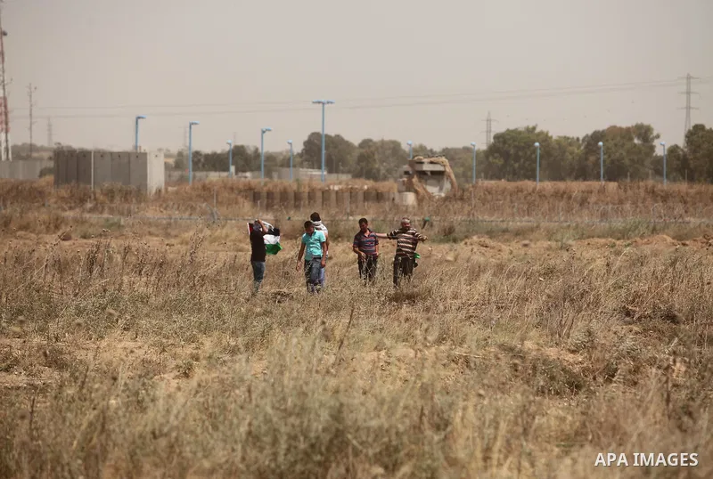 Palestinians take part during a rally to commemorate the "Nakba" or "catastrophe" in Arabic in reference to the establishment in 1948 of the state of Israel near the Nahal Oz crossing east of Gaza City on May 15, 2016. "...