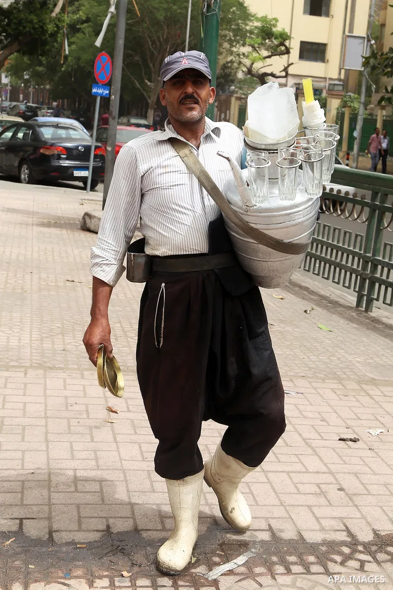 An Egyptian vendor sells chilled water during a sweltering heat wave, in Cairo, Egypt, on May 15, 2016. Photo by Amr Sayed