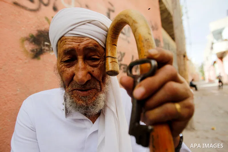 A Palestinian man holds key symbolising the homes they left in 1948 in front of his house on the 68th anniversary of the "Nakba" in al-Fawar Palestinian refugee camp, south of the West Bank city of Hebron on May 15, 2016...
