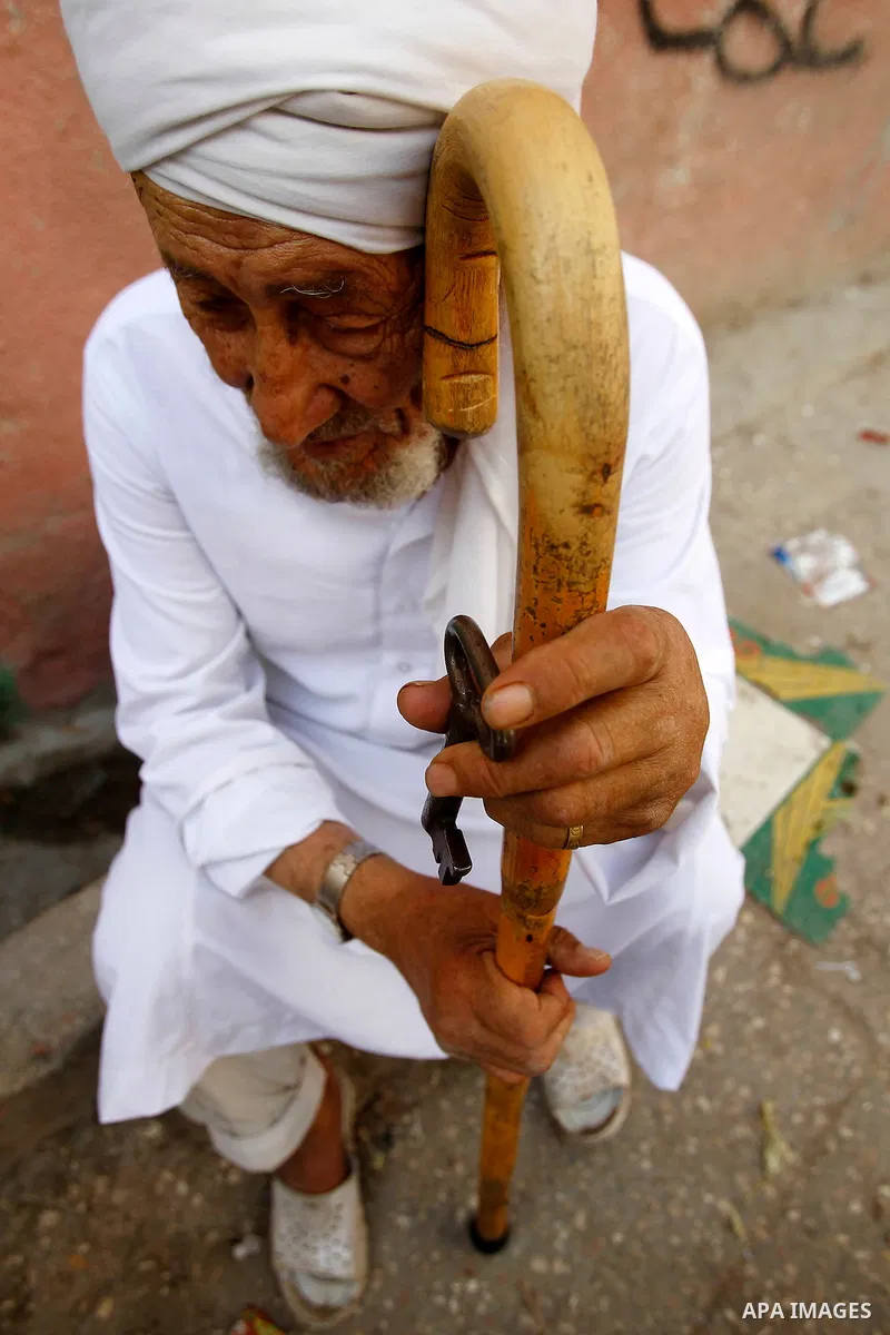 A Palestinian man holds key symbolising the homes they left in 1948 in front of his house on the 68th anniversary of the "Nakba" in al-Fawar Palestinian refugee camp, south of the West Bank city of Hebron on May 15, 2016...