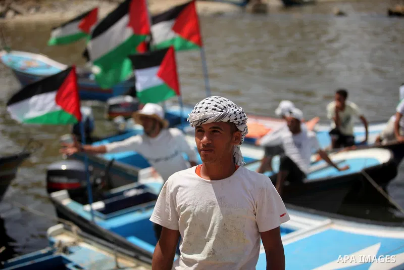 Palestinian patients take part during a protest demanding for treatment abroad, at the Seaport of Gaza City on May 18, 2016. Photo by Ashraf Amra