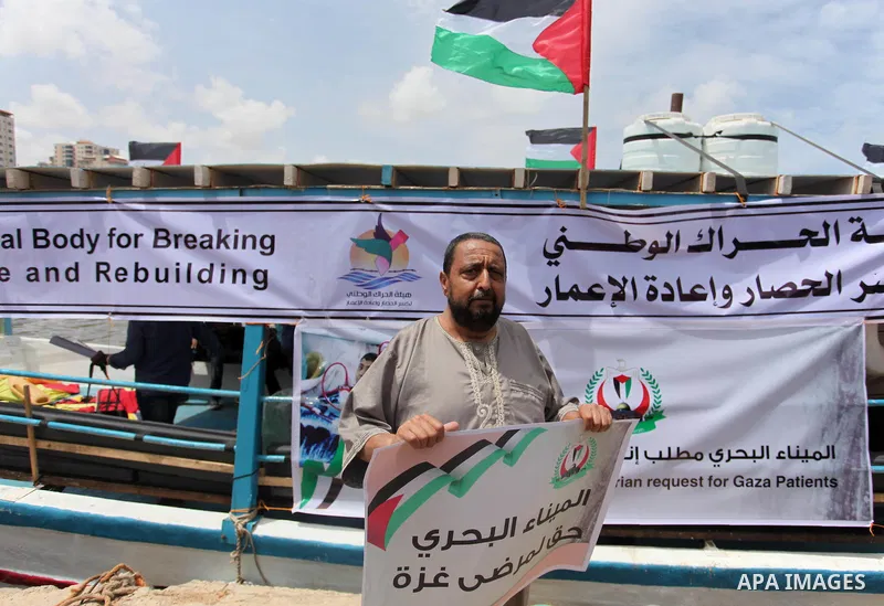 Palestinian patients take part during a protest demanding for treatment abroad, at the Seaport of Gaza City on May 18, 2016. Photo by Ashraf Amra