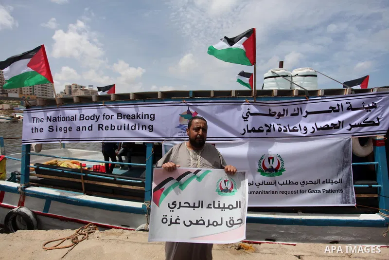 Palestinian patients take part during a protest demanding for treatment abroad, at the Seaport of Gaza City on May 18, 2016. Photo by Ashraf Amra