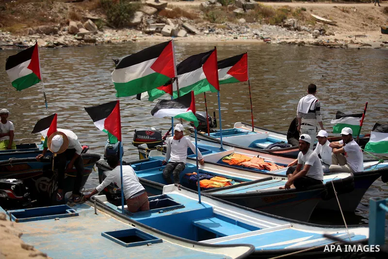 Palestinian patients take part during a protest demanding for treatment abroad, at the Seaport of Gaza City on May 18, 2016. Photo by Ashraf Amra