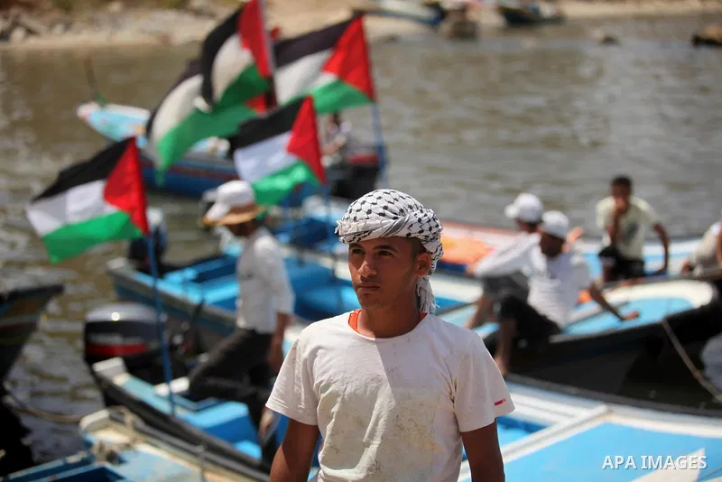 Palestinian patients take part during a protest demanding for treatment abroad, at the Seaport of Gaza City on May 18, 2016. Photo by Ashraf Amra