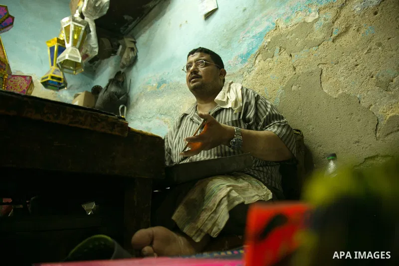 An Egyptian worker manufactures a traditional Ramadan lantern known as "Fanous" in Arabic, at his workshop ready for the month of holy Ramadan in cairo, Egypt, on May 18, 2016. Photo by Amr Sayed