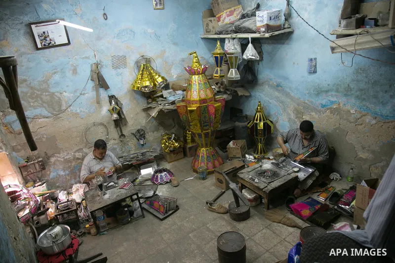 An Egyptian worker manufactures a traditional Ramadan lantern known as "Fanous" in Arabic, at his workshop ready for the month of holy Ramadan in cairo, Egypt, on May 18, 2016. Photo by Amr Sayed