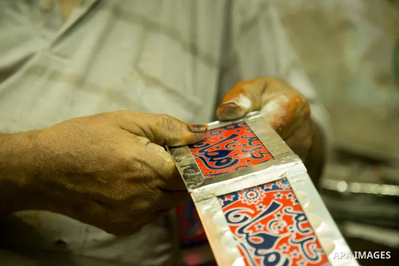 An Egyptian worker manufactures a traditional Ramadan lantern known as "Fanous" in Arabic, at his workshop ready for the month of holy Ramadan in cairo, Egypt, on May 18, 2016. Photo by Amr Sayed