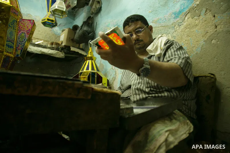 An Egyptian worker manufactures a traditional Ramadan lantern known as "Fanous" in Arabic, at his workshop ready for the month of holy Ramadan in cairo, Egypt, on May 18, 2016. Photo by Amr Sayed