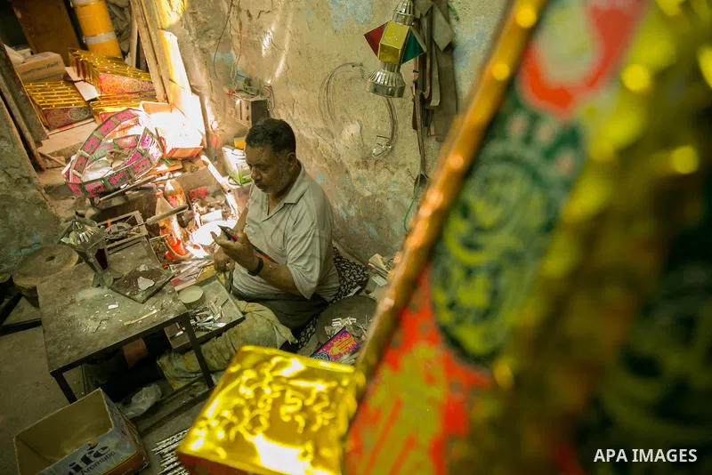 An Egyptian worker manufactures a traditional Ramadan lantern known as "Fanous" in Arabic, at his workshop ready for the month of holy Ramadan in cairo, Egypt, on May 18, 2016. Photo by Amr Sayed