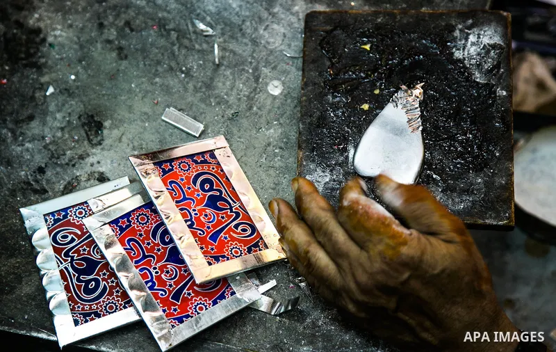 An Egyptian worker manufactures a traditional Ramadan lantern known as "Fanous" in Arabic, at his workshop ready for the month of holy Ramadan in cairo, Egypt, on May 18, 2016. Photo by Amr Sayed