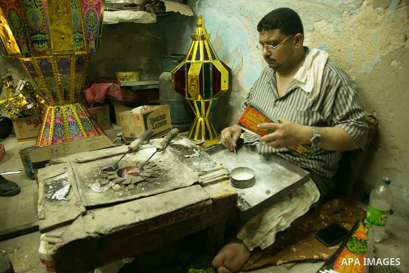 An Egyptian worker manufactures a traditional Ramadan lantern known as "Fanous" in Arabic, at his workshop ready for the month of holy Ramadan in cairo, Egypt, on May 18, 2016. Photo by Amr Sayed