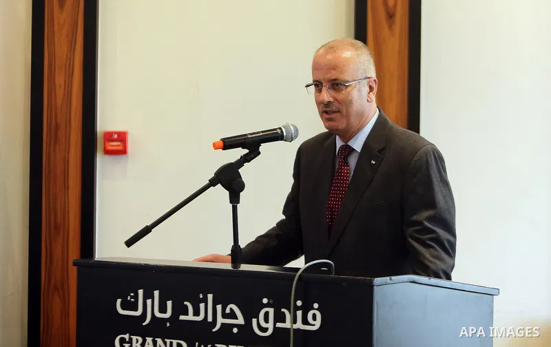 Palestinian Prime Minister Rami Hamdallah speaks during a ceremony of World Telecommunication Day in the West Bank city of Ramallah, on May 19, 2016. Photo by Prime Minister Office