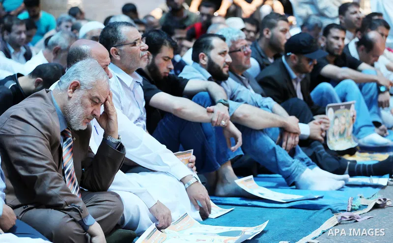 Palestinian supporters of the Islamic Jihad Movement attend Friday prayers to show solidarity with Palestinian prisoners in Israeli Jails, in front of Red cross office in Gaza city, on May 20, 2016. Photo by Mohammed Asa...