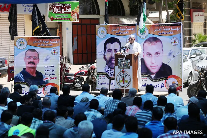 Palestinian supporters of the Islamic Jihad Movement attend Friday prayers to show solidarity with Palestinian prisoners in Israeli Jails, in front of Red cross office in Gaza city, on May 20, 2016. Photo by Mohammed Asa...