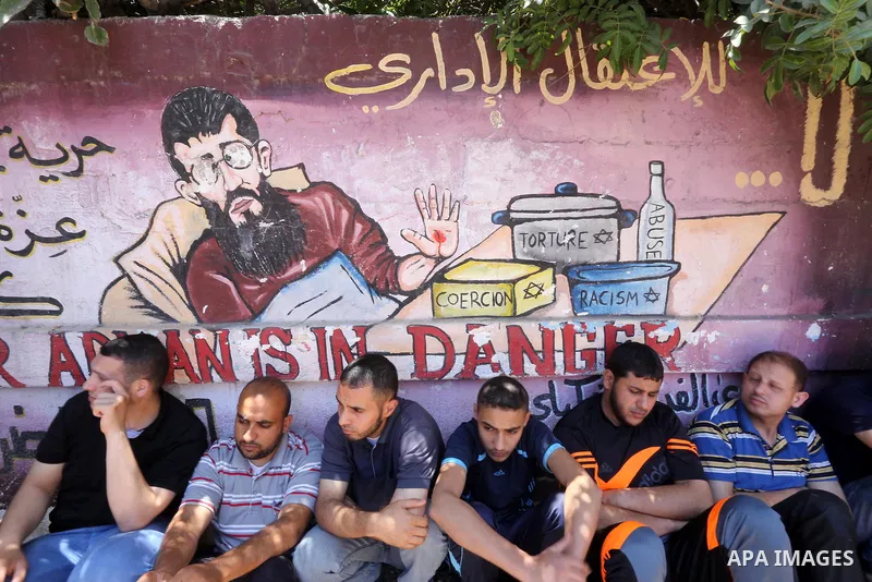Palestinian supporters of the Islamic Jihad Movement attend Friday prayers to show solidarity with Palestinian prisoners in Israeli Jails, in front of Red cross office in Gaza city, on May 20, 2016. Photo by Mohammed Asa...